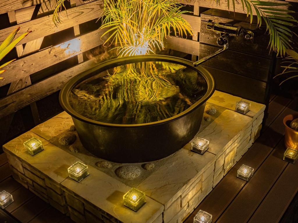 Fotografie z fotogalerie ubytování 森のフェアリー Cottage Morino Fairy All cotage with open-air bath with sea view or river view v destinaci Jakušima