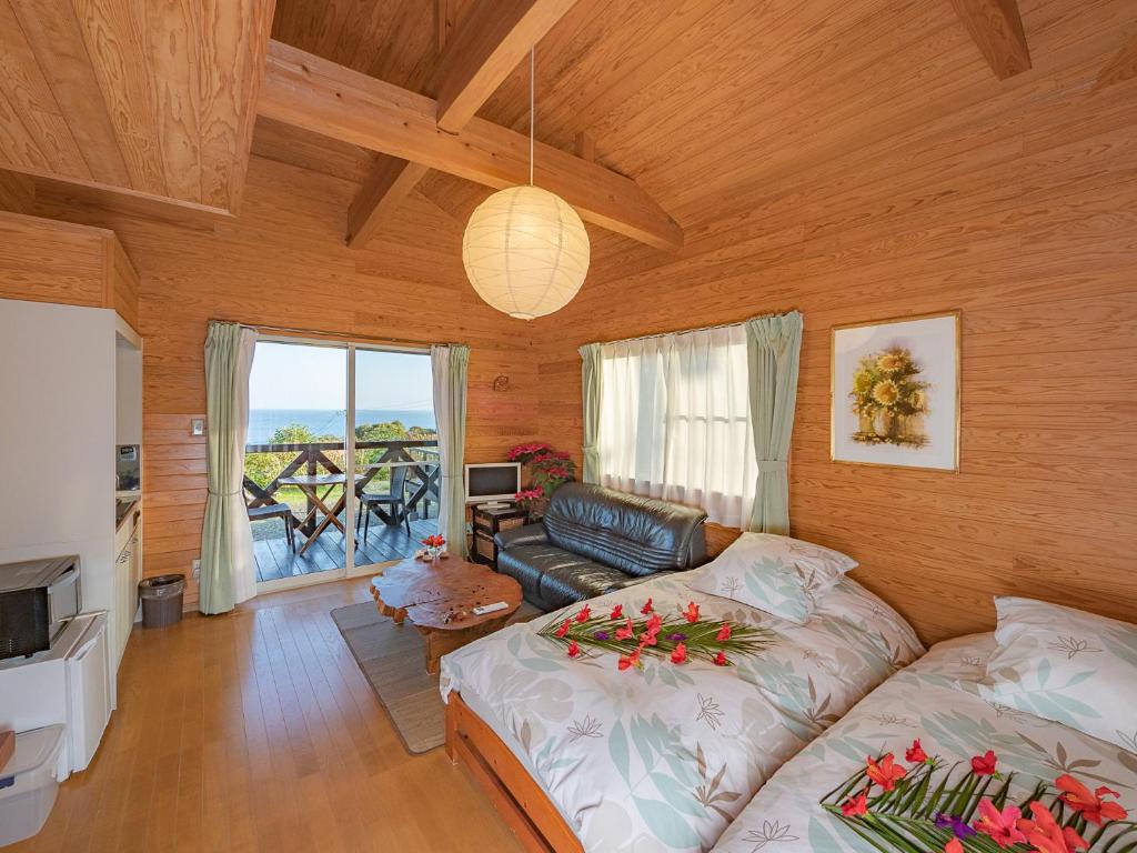 Postel nebo postele na pokoji v ubytování 森のフェアリー Cottage Morino Fairy All cotage with open-air bath with sea view or river view