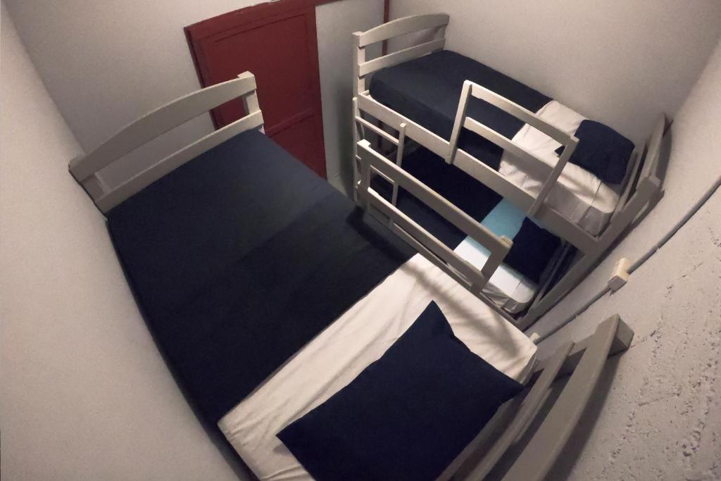 Postel nebo postele na pokoji v ubytování Hostel Auikyani