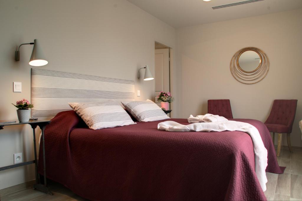 Postel nebo postele na pokoji v ubytování Hôtel La Bastide d'Iris