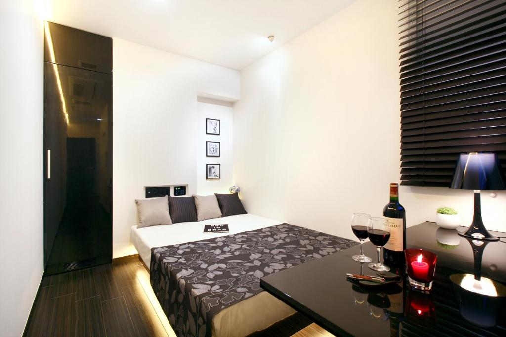 Postel nebo postele na pokoji v ubytování Hotel DUO kinsicho