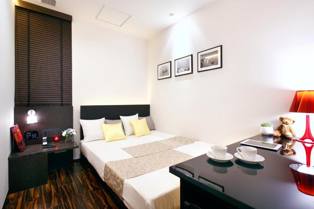 Postel nebo postele na pokoji v ubytování Hotel DUO kinsicho