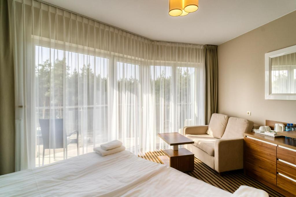Postel nebo postele na pokoji v ubytování Hotel White