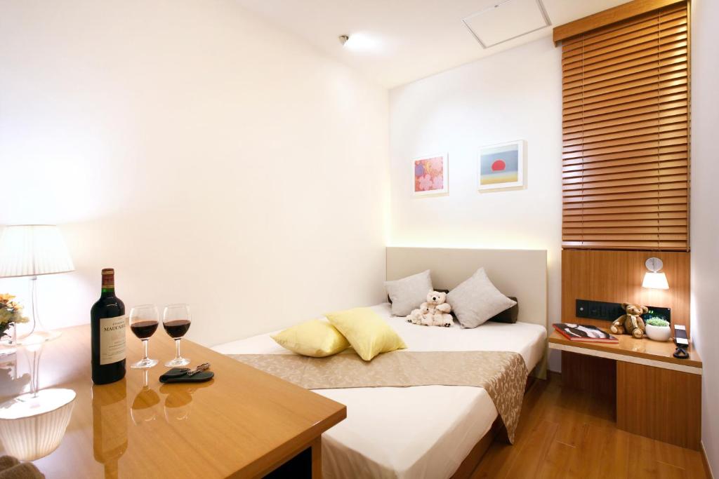 Postel nebo postele na pokoji v ubytování Hotel DUO kinsicho