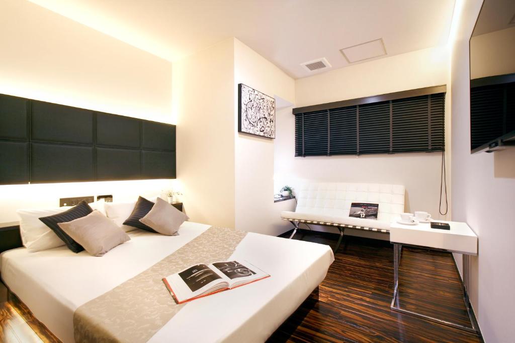 Postel nebo postele na pokoji v ubytování Hotel DUO kinsicho