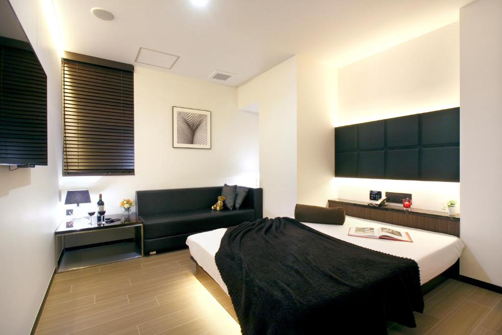 Postel nebo postele na pokoji v ubytování Hotel DUO kinsicho