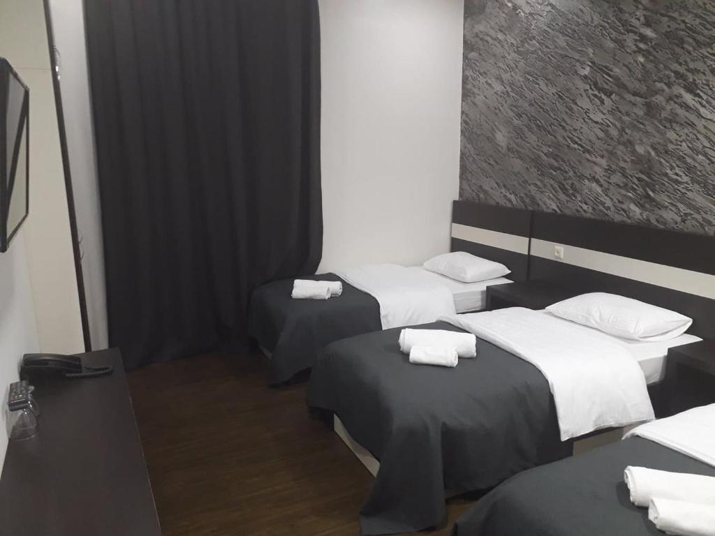 Voodi või voodid majutusasutuse West Tower Hotel toas