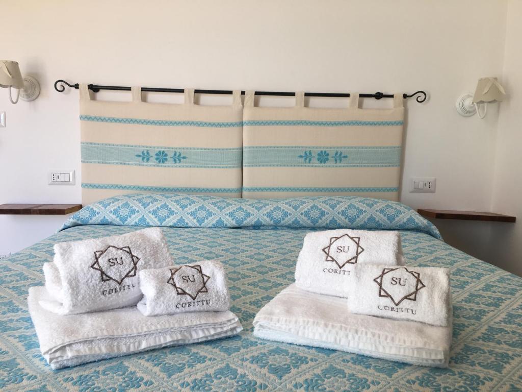 Postel nebo postele na pokoji v ubytování Su Corittu Guesthouse