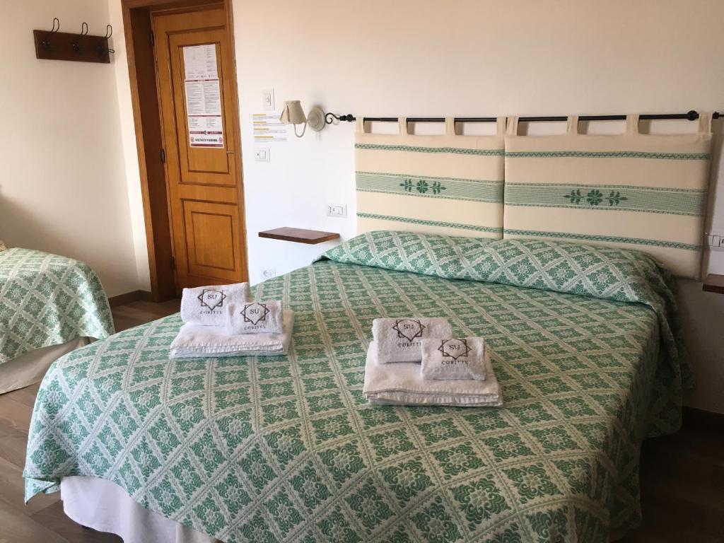Postel nebo postele na pokoji v ubytování Su Corittu Guesthouse