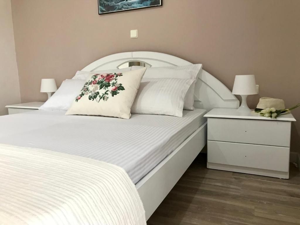 Postel nebo postele na pokoji v ubytování Joy Hotel