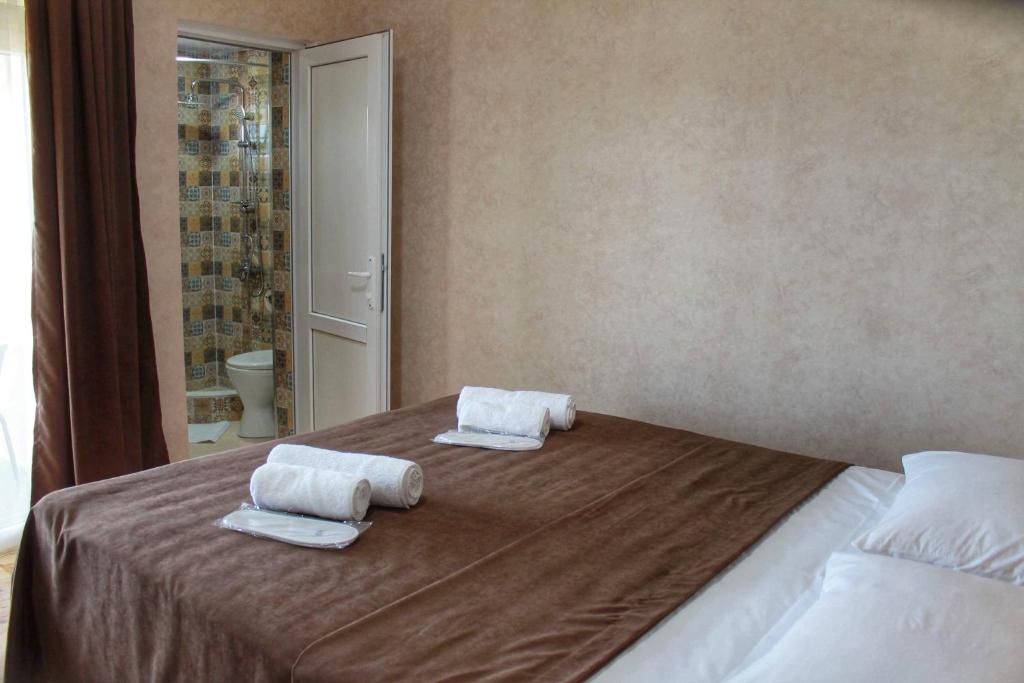 Llit o llits en una habitació de Guest House Maradona