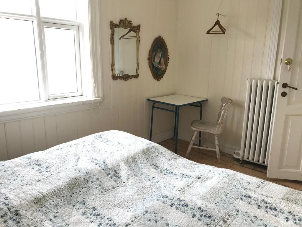 Postel nebo postele na pokoji v ubytování Steinhúsið