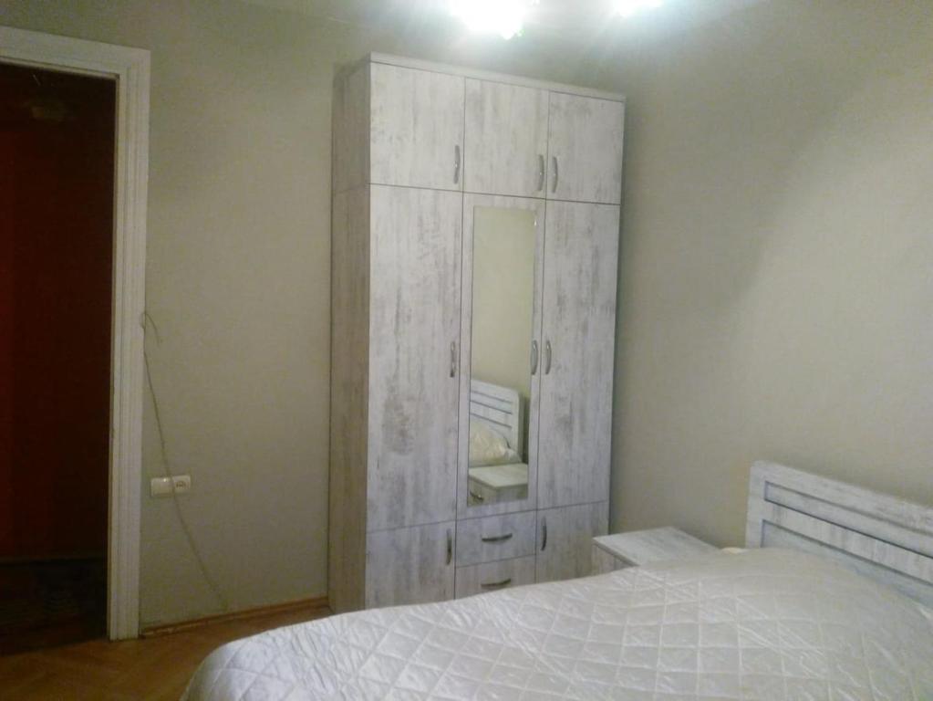 Postel nebo postele na pokoji v ubytování Tbilisi Home