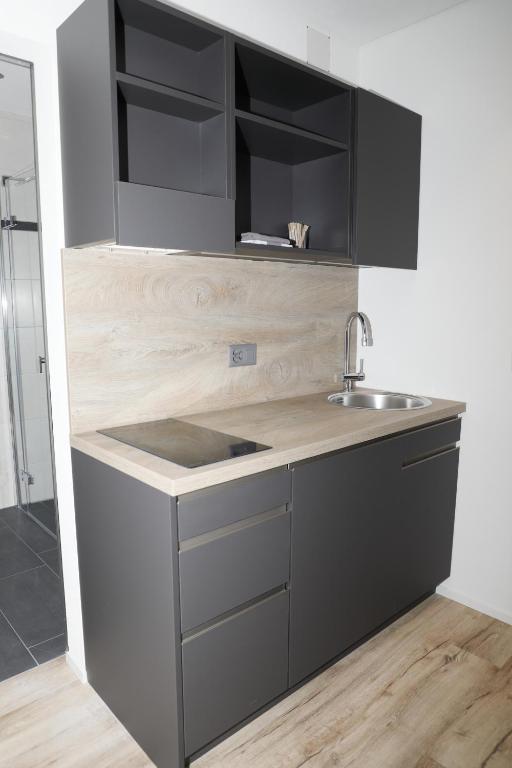 Kuchyň nebo kuchyňský kout v ubytování Business Apartments Reichenburg