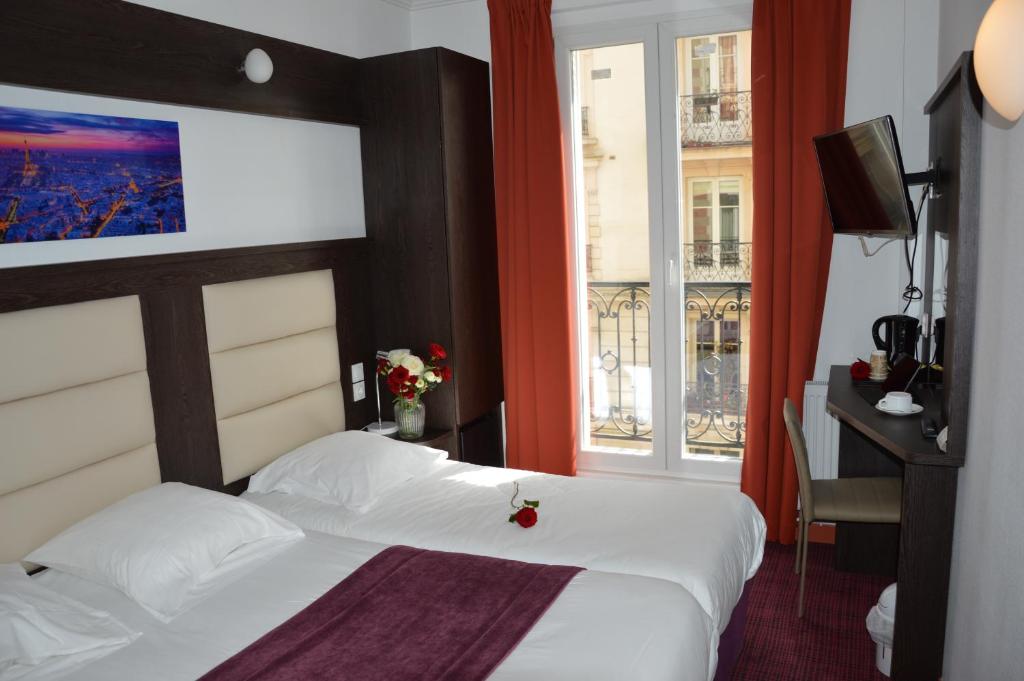 Un ou plusieurs lits dans un hébergement de l'établissement Parc Hotel