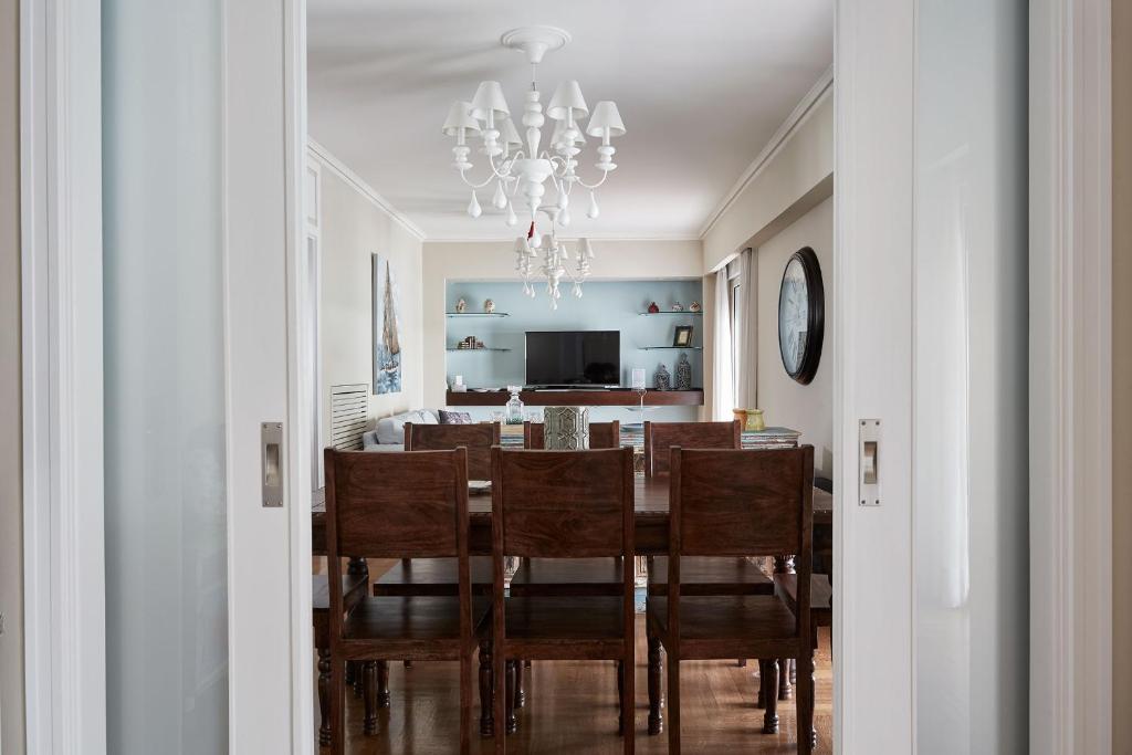 a dining room with a table and chairs at Fabulous 3BD Apt close to Kalimarmaro in Athens