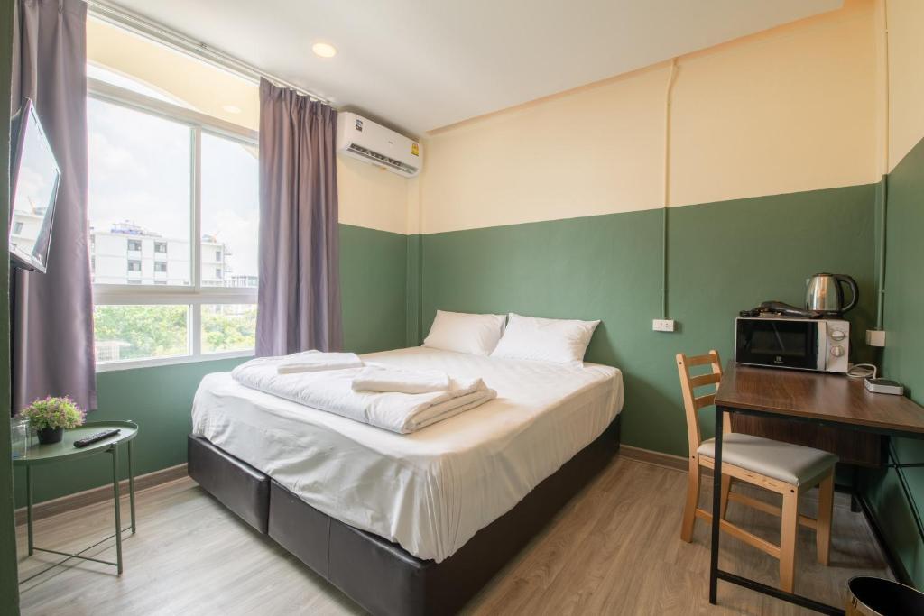 Ένα ή περισσότερα κρεβάτια σε δωμάτιο στο Spacy BKK