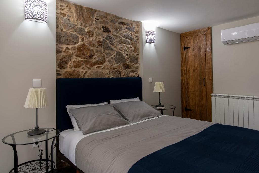 Postel nebo postele na pokoji v ubytování Quinta do Ragal