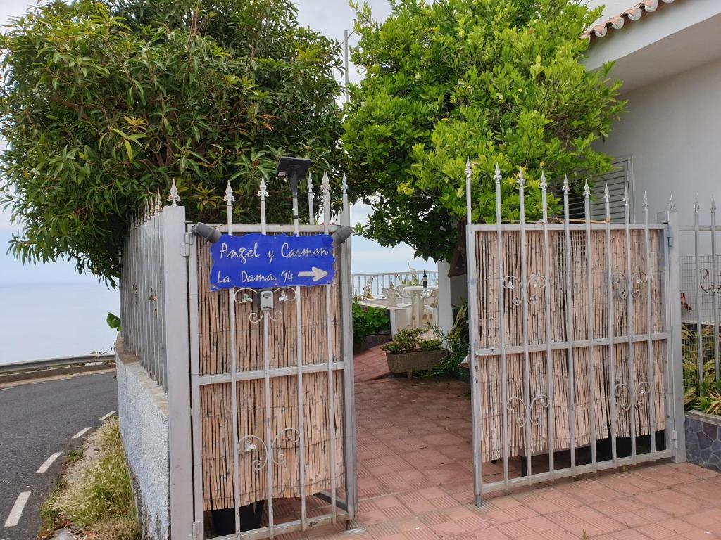 a pair of gates in front of a house at Casa Angel y Carmen (La Dama, La Gomera) in El Cercado