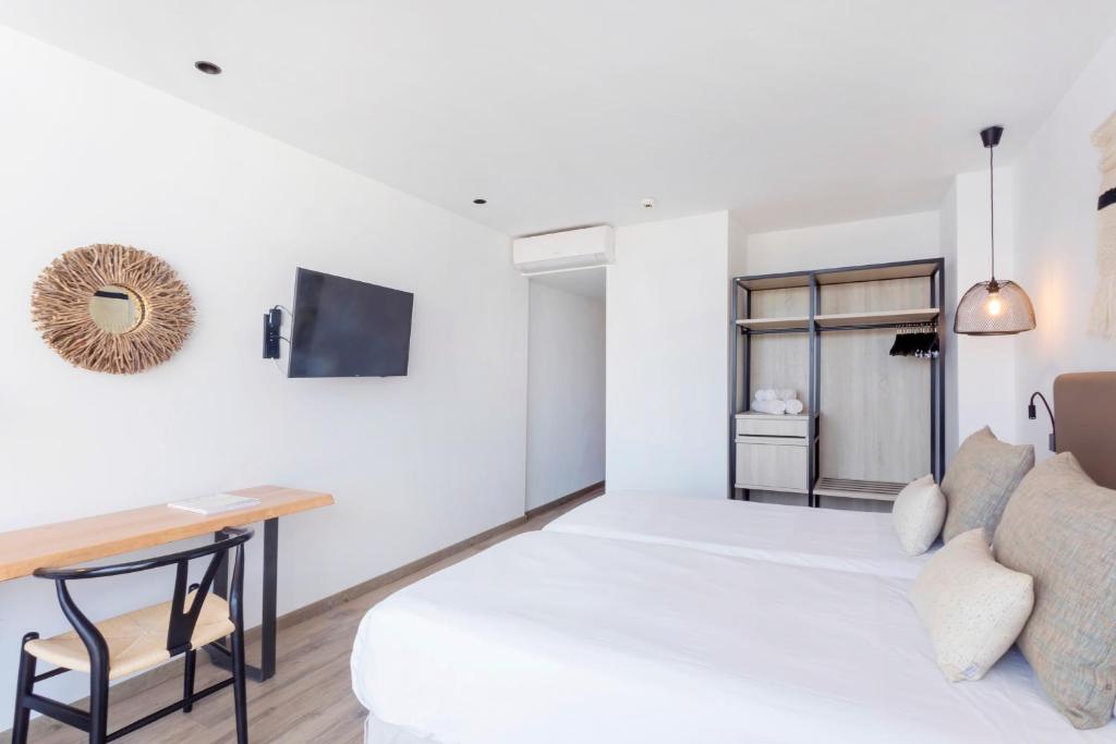 Hotel Sa Clau by Mamboにあるベッド