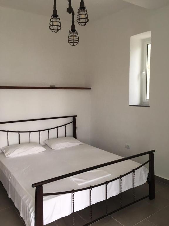 Postel nebo postele na pokoji v ubytování Valentina Rooms