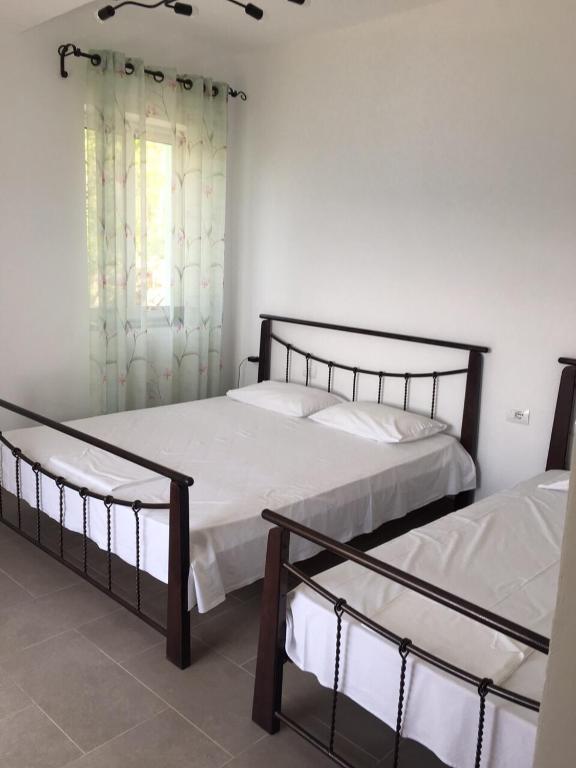 Postel nebo postele na pokoji v ubytování Valentina Rooms