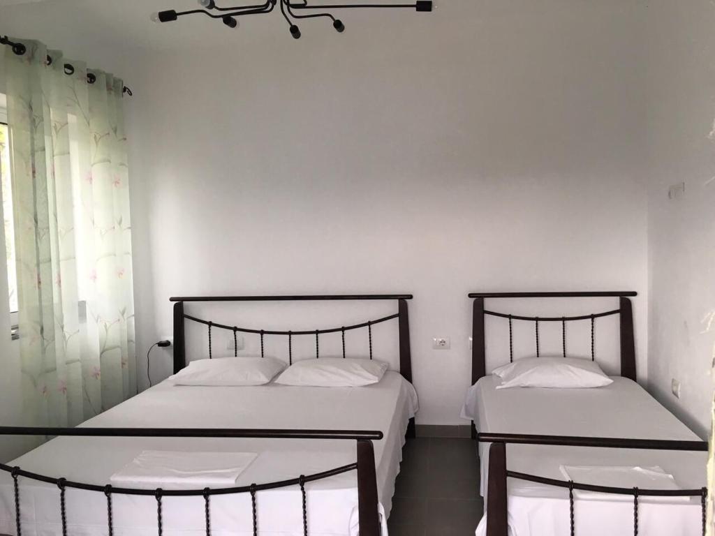 Postel nebo postele na pokoji v ubytování Valentina Rooms