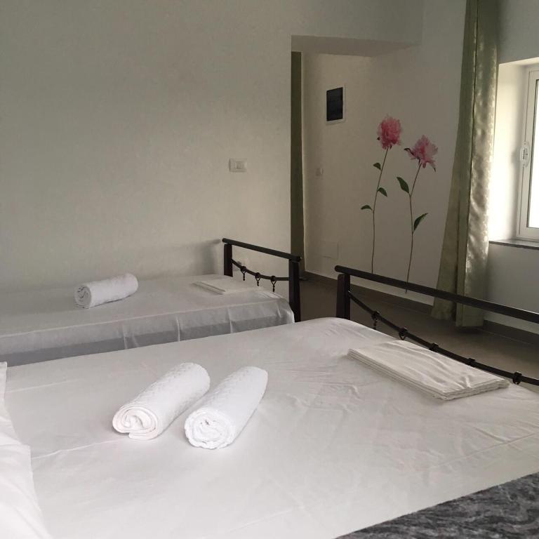 Postel nebo postele na pokoji v ubytování Valentina Rooms
