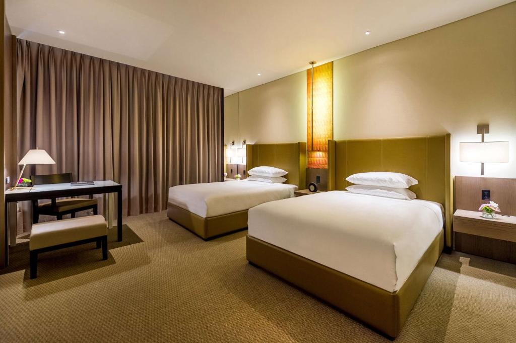 Postel nebo postele na pokoji v ubytování Grand Hyatt Bogota