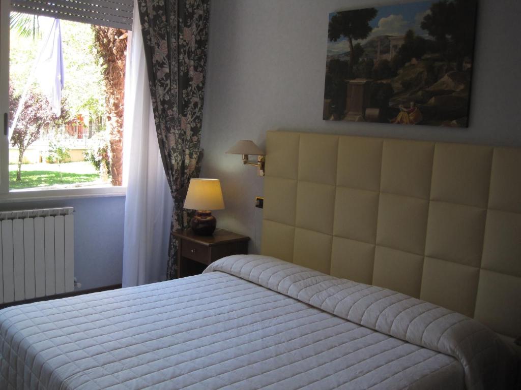 Postel nebo postele na pokoji v ubytování Hotel Gioia Garden