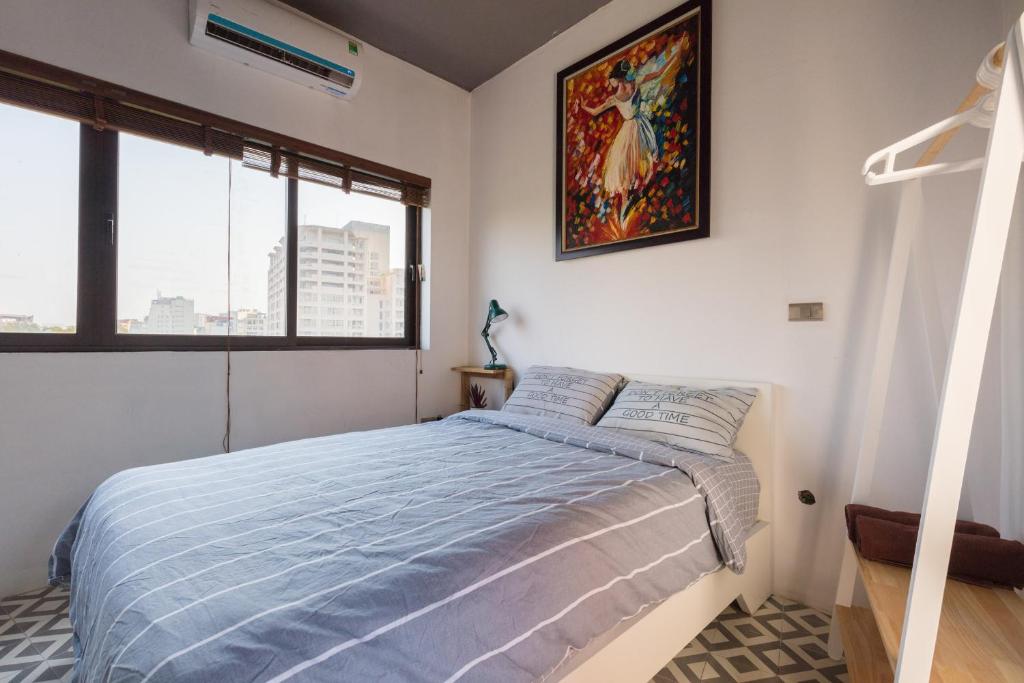 Postel nebo postele na pokoji v ubytování SaziHome Le Thanh Tong Hanoi