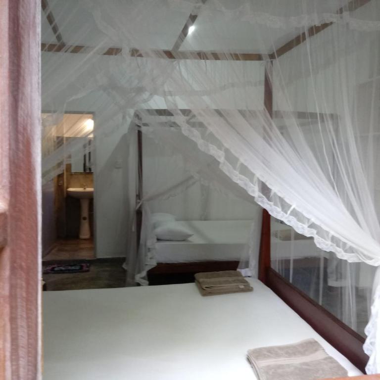 Postel nebo postele na pokoji v ubytování Unawatuna Backpacker Lodge