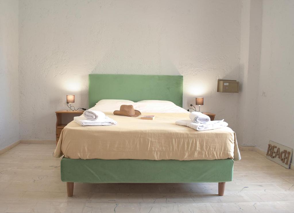 Postel nebo postele na pokoji v ubytování Arhodiko Hotel