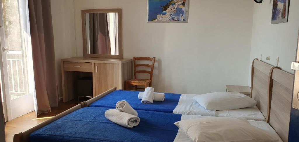 Ένα ή περισσότερα κρεβάτια σε δωμάτιο στο Sparta Team Hotel