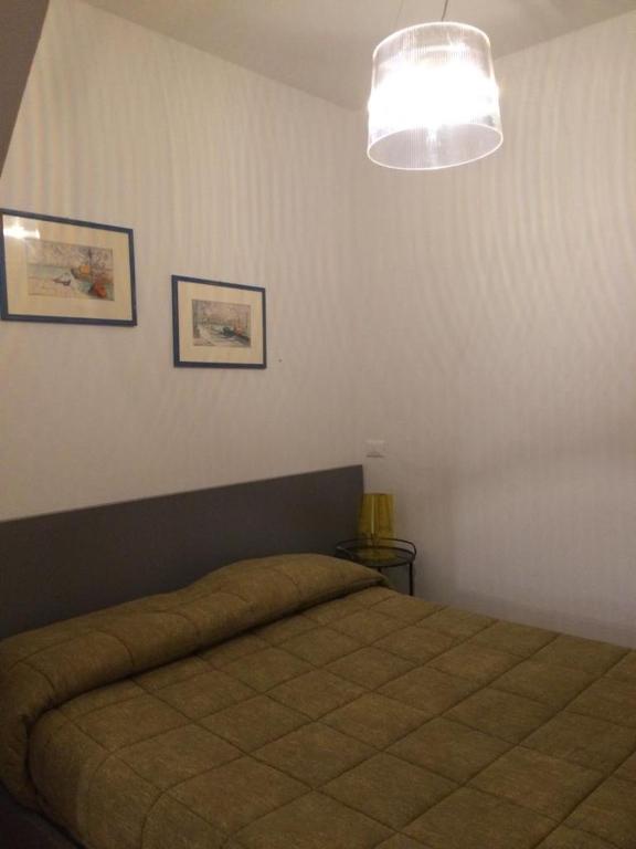 Postel nebo postele na pokoji v ubytování Camere Nicolina 3