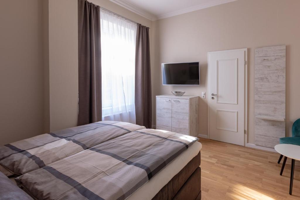 Postel nebo postele na pokoji v ubytování Nordic Wave Apartments