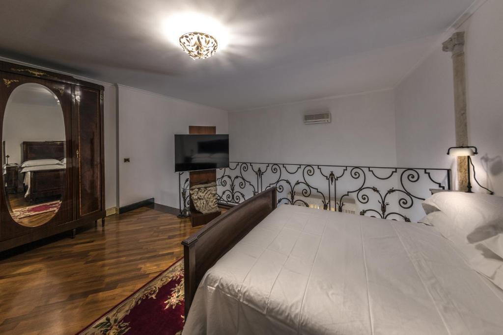 Łóżko lub łóżka w pokoju w obiekcie VILLA DURANTE