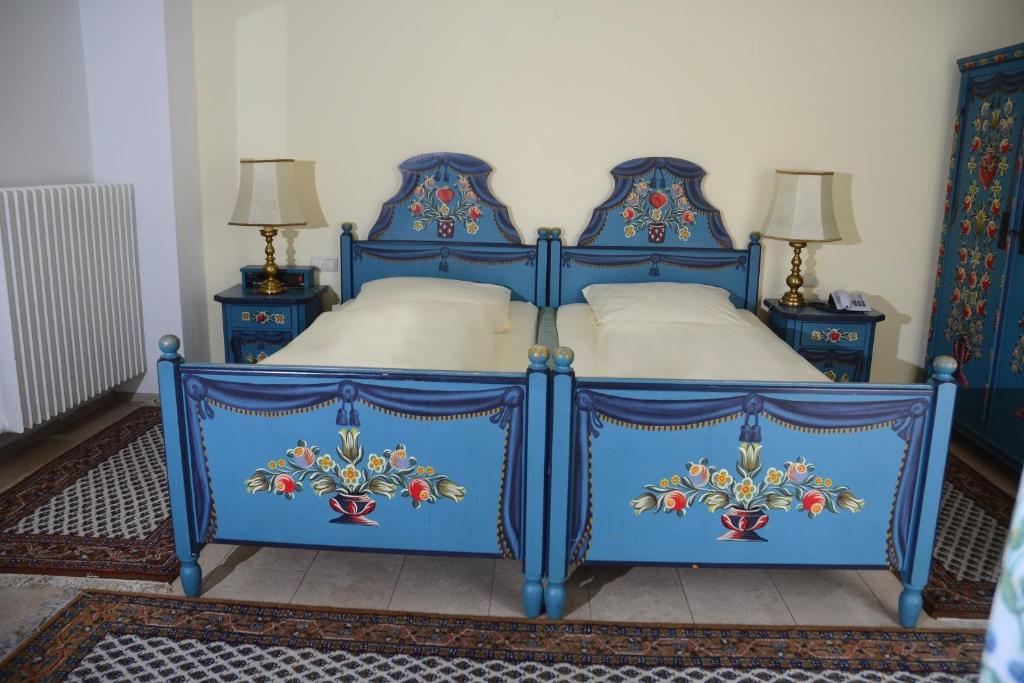 Postel nebo postele na pokoji v ubytování Hotel Das Schlössl