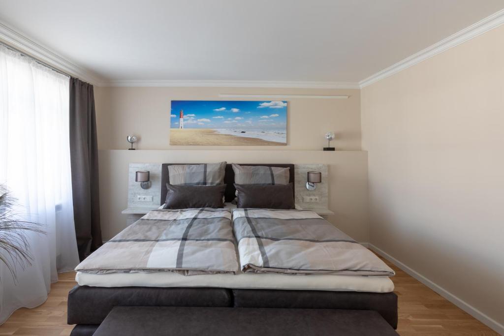 Postel nebo postele na pokoji v ubytování Nordic Wave Apartments