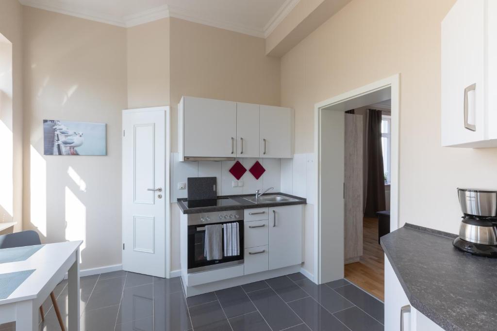 Kuchyň nebo kuchyňský kout v ubytování Nordic Wave Apartments