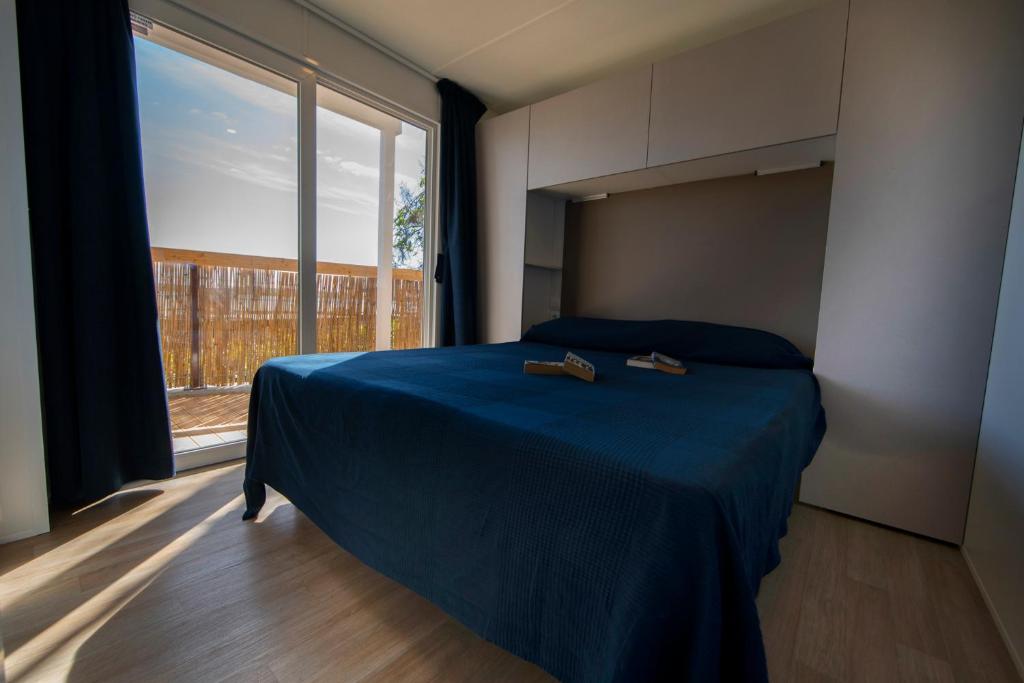 Postel nebo postele na pokoji v ubytování Camping Bergamini
