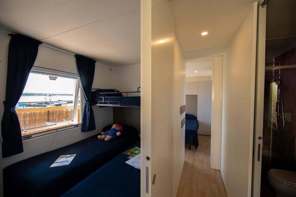 Postel nebo postele na pokoji v ubytování Camping Bergamini