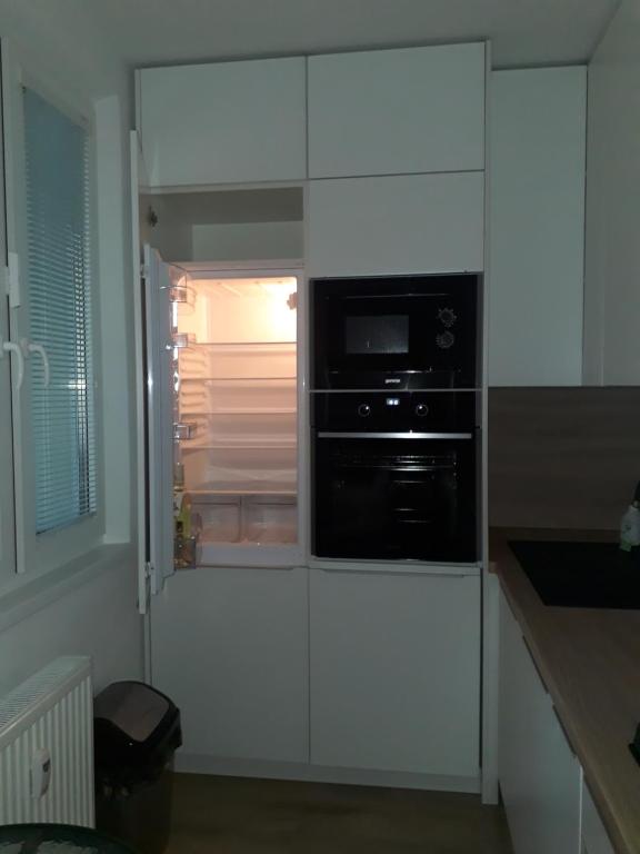 A kitchen or kitchenette at Apartment Klimka with balcony, free wifi and free parking