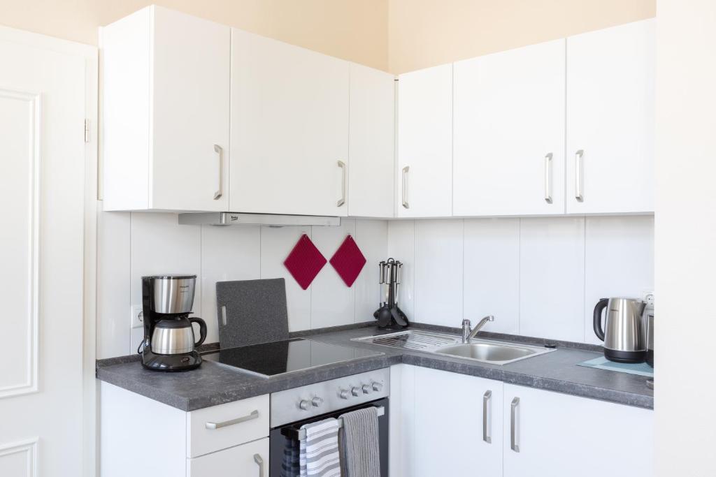 Kuchyň nebo kuchyňský kout v ubytování Nordic Wave Apartments