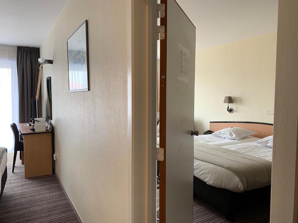 Postel nebo postele na pokoji v ubytování Hotel Arcato