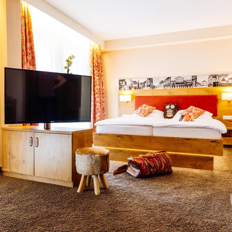 TV a/nebo společenská místnost v ubytování Hotel Pension Fortuna
