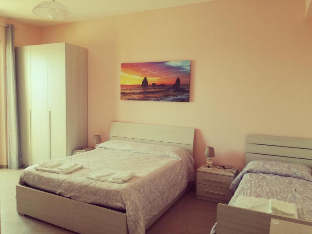 Postel nebo postele na pokoji v ubytování B&B la spiaggetta di Stazzo