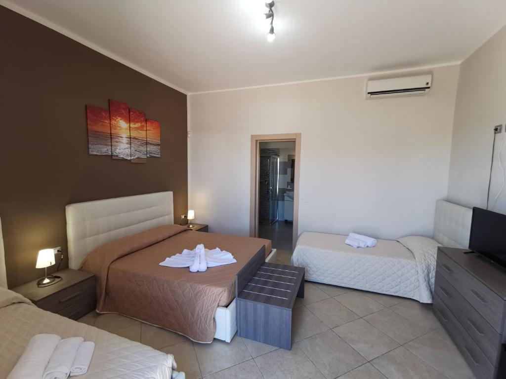 Кровать или кровати в номере Samanà B&B con Spiaggia Privata a Punta Prosciutto