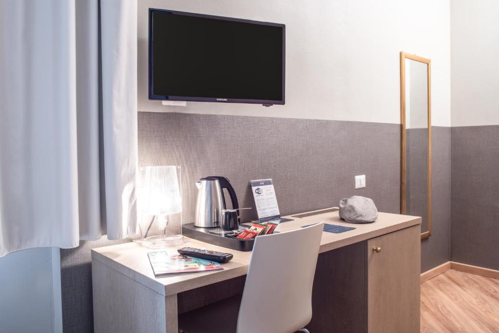 TV a/nebo společenská místnost v ubytování Hotel Oro Blu