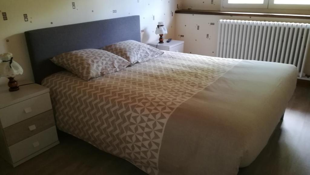 Postel nebo postele na pokoji v ubytování Gîte de Bellevue Maison Traditionnelle Vosgienne